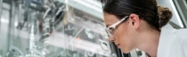 Battery recycling closes the loop in electromobility - Lab technician Theresa Simon checks the crystallization of the lithium salts in a laboratory reactor.