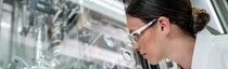 Battery recycling closes the loop in electromobility - Lab technician Theresa Simon checks the crystallization of the lithium salts in a laboratory reactor.