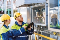Tow employees during an inspection tour of the demonstration plant