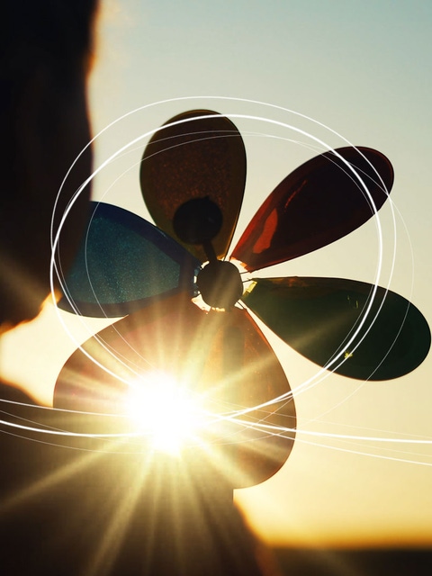 Young girl with Pinwheel in sun    Young girl with Pinwheel in sun