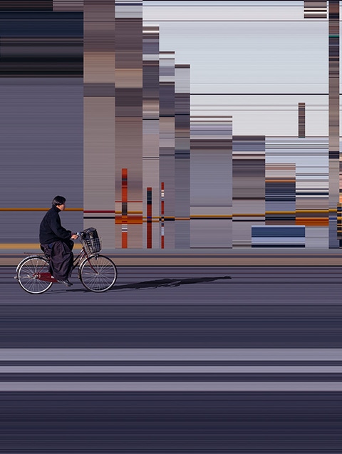 Person riding a bicycle through the city, background distorted