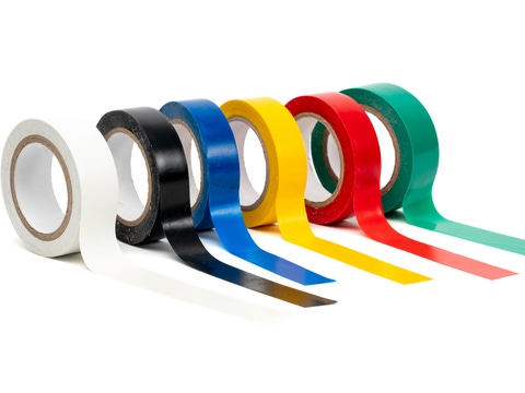 Photo multi colored insulating tapes on a white background. Photo multi colored insulating tapes on a white background.