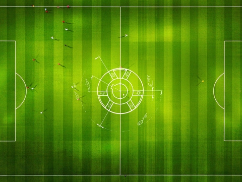 An aerial picture of a football field and football players. In the middle, there is a sketch of a heatpump to indicate the enormous size it will have. An aerial picture of a football field and football players. In the middle, there is a sketch of a heatpump to indicate the enormous size it will have.