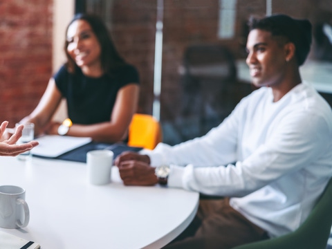 Businessman leading a meeting in a modern office. Experienced mature businessman briefing his colleagues in a meeting room. Group of creative businesspeople working as a team. Businessman leading a meeting in a modern office. Experienced mature businessman briefing his colleagues in a meeting room. Group of creative businesspeople working as a team.