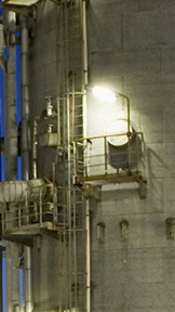 Production factory with bright lights at night Production factory with bright lights at night