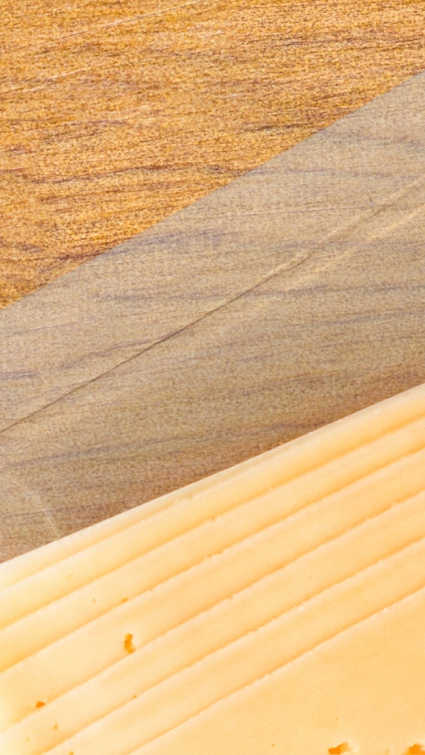 Cheese package lying on a wooden table Cheese package lying on a wooden table