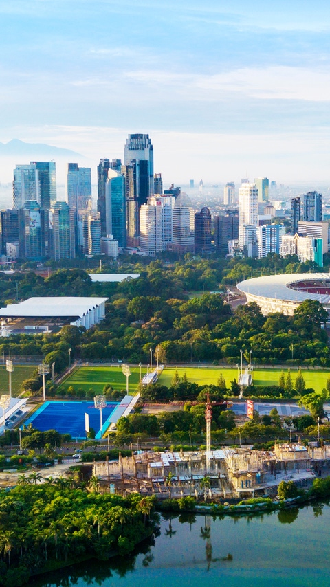 JAKARTA - Indonesia. March 26, 2018: Beautiful landscape of Senayan stadium complex with skyscrapers under blue sky 