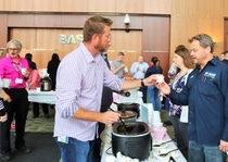 BASF employee Forest Rutherford serves up his and Terry Mack’s award-winning chili at the company’s Chili Cook Off to support cancer awareness and research.
