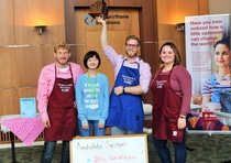 BASF employees Dan Niedzwiecki, Chris Meyers, Yalin Liu, and Chris Meyers receive a trophy for the most money raised during the company’s Chili Cook Off event. 