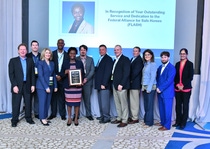 Erika Peterman, BASF, accepting the Board member of the Year award from Leslie Chapman-Henderson, Federal Alliance of Safe Homes (FLASH) in Clearwater, Florida.