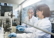 BASF technicians in a white biotechnology research lab in Germany are working with microorganisms to produce enzymes.