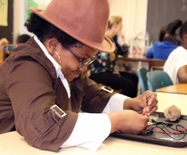 A McIntyre Elementary student learns about atoms and electricity with Kids’ Lab, a hands-on science education program developed by BASF.