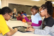 Fifth grade students at McIntyre Elementary work together to build a battery from materials provided by the Kids’ Lab program from BASF.