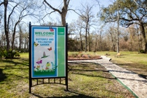 A sign welcomes guests to the butterfly and pollinator garden on the BASF Geismar site.