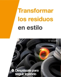 Un montón de neumáticos de coche apilados juntos. Hay una espiral de luz encima de los neumáticos. En el texto pone “Transformación de residuos en estilo”.