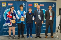 Winners of the Sustainable Practice Award at the 45th WorldSkills Competition in Kazan, Russia (from left to right): Maxine Colligan from Australia (second place and bronze medal winner in the Car Painting category), Kam Hung Li from Hong Kong, China (first place), and Anthony Bourgeade from France (third place) together with Roar Solberg, Vice President Sales Automotive Refinish Coatings Solutions EMEA, BASF, and Alexander Amiri, Director of Sponsorship and Partnership WorldSkills International.  Photo: WorldSkills