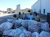 BASF employees collected thousands of drink cans to contribute to Boy Scouts Troop 223. Pictured from left to right: Sherry Lang, Cub master, Jonathan Lang, Unit Commissioner, George Vann, Vice President of BASF McIntosh, Maurice Ware, Environmental, Health and Safety Team Leader and Willard Law, Scout Master.