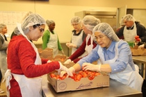 BASF employees sort and inspect food for meal boxes from Forgotten Harvest that will be distributed to Southeast Michigan families in need.