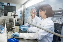 BASF technicians in a white biotechnology research lab in Germany are working with microorganisms to produce enzymes.