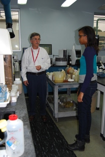 BASF Chemist Ray Noletto gives McIntosh High School student Xavier Barns a tour of a lab.