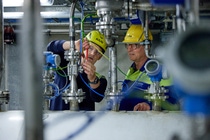 In BASF’s ChemCyclingTM project, plastic waste is transformed into pyrolysis oil using a thermochemical process. The oil can be fed in the BASF Verbund, replacing fossil resources. Using a mass balance approach, new products are manufactured with it. These have the same properties as products from fossil raw materials. BASF works together with partners such as Quantafuel, a start-up headquartered in Oslo, Norway. Quantafuel is specialized in the pyrolysis of mixed plastic waste and the integrated purification of the resulting oil.Rasmus Kærsgaard (left), Plant Director, Quantafuel, and Dr. Michael Bachtler (right), who is working on BASF’s ChemCyclingTM project, in Quantafuel’s pyrolysis and purification plant in Skive, Denmark. In BASF’s ChemCyclingTM project, plastic waste is transformed into pyrolysis oil using a thermochemical process. The oil can be fed in the BASF Verbund, replacing fossil resources. Using a mass balance approach, new products are manufactured with it. These have the same properties as products from fossil raw materials. BASF works together with partners such as Quantafuel, a start-up headquartered in Oslo, Norway. Quantafuel is specialized in the pyrolysis of mixed plastic waste and the integrated purification of the resulting oil.Rasmus Kærsgaard (left), Plant Director, Quantafuel, and Dr. Michael Bachtler (right), who is working on BASF’s ChemCyclingTM project, in Quantafuel’s pyrolysis and purification plant in Skive, Denmark.