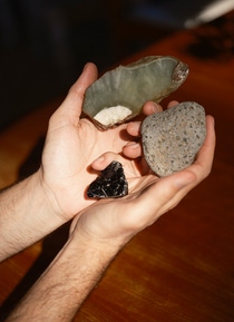 Two hands holding various mineral fragments. Two hands holding various mineral fragments.