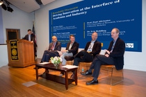 Representatives of industry, academia and government participate in a roundtable discussion titled, “Driving Innovation at the Interface of Academia and Industry” moderated by Michael Pcolinksi, Vice President, Advanced Materials and Systems Research, BASF Corporation (at podium). Pictured left to right: Dr. Peter Eckes, President of Bioscience Research and North America Research Representative, BASF; Prof. Mark Coopersmith, Faculty Director, Entrepreneurship and Innovation, Haas School of Business, UC Berkeley; Dr. Eric Rohlfing, Acting Director, Advanced Research Projects Agency-Energy (ARPA-E); and Prof. Paul Alivisatos, Vice Chancellor of Research, UC Berkeley. Representatives of industry, academia and government participate in a roundtable discussion titled, “Driving Innovation at the Interface of Academia and Industry” moderated by Michael Pcolinksi, Vice President, Advanced Materials and Systems Research, BASF Corporation (at podium). Pictured left to right: Dr. Peter Eckes, President of Bioscience Research and North America Research Representative, BASF; Prof. Mark Coopersmith, Faculty Director, Entrepreneurship and Innovation, Haas School of Business, UC Berkeley; Dr. Eric Rohlfing, Acting Director, Advanced Research Projects Agency-Energy (ARPA-E); and Prof. Paul Alivisatos, Vice Chancellor of Research, UC Berkeley.