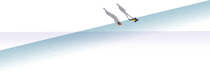 Birds-eye-view of two people walking across a blue and purple floor. Birds-eye-view of two people walking across a blue and purple floor.