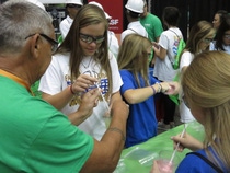 Students enjoy creating chemistry while making slime with BASF employees at Worlds of Opportunity Career Expo. MCINTOSH, AL