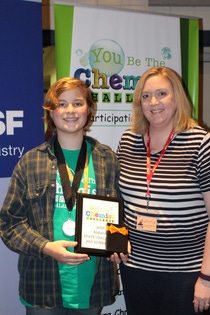 Chance Dockeny, an eighth grade student at Meridianville Middle School, stands with his science teacher as one of three students to receive a runners up award