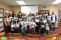 Volunteers from BASF TOTAL Petrochemicals present certificates to 6 – 8th grade You Be The Chemist challenge participants at Thomas Jefferson Middle School on Saturday, March 4. Volunteers from BASF TOTAL Petrochemicals present certificates to 6 – 8th grade You Be The Chemist challenge participants at Thomas Jefferson Middle School on Saturday, March 4.