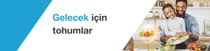Bir adam ve bir çocuk mutfakta taze sebzeleri hazırlıyor. Metinde şunlar yazıyor: “Geleceğin tohumları.”