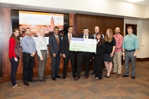 A team of University of Texas (UT) Austin engineering students whose idea to harness the sun's rays to power the UFCU Disch-Falk Field — home of UT baseball — was recently named the grand prize winner of the BASF Team Chemistry Challenge and was awarded $25,000. Pictured from left to right included: Lauren Fedele, Assistant Sustainability Coordinator for Texas Athletics; Matt Blackwell, BASF’s Manager of Civil & Mechanical Engineering Design at the Freeport, Texas site; Patrick Harmon, BASF’s Industry Manager for Industrial Petrochemicals; Bradley Cooper, chemical engineering major at UT; Kush Muzumdar, chemical engineering major at UT; Taylor Lopez-Huebner, petroleum engineering major at UT; Teresa Wu, chemical engineering major at UT; Tom Yura, Senior Vice President and Manager of the BASF site in Geismar, Louisiana, and executive sponsor of BASF's UT School Recruiting Team; Jennifer Hobson, UT’s Zero Waste Coordinator; Hunter Mangrum, UT’s Sustainability Coordinator for the Division of Housing and Food; and Merrick MyCue, Assistant Athletics Director of Events, Operations & Special Events for Texas Athletics.