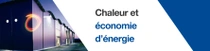 Un bâtiment moderne à l’extérieur au crépuscule avec des lumières allumées.  Un tourbillon lumineux flotte au bord du bâtiment. Le texte indique : « Une vie au chaud en baissant la consommation d’énergie. » 
