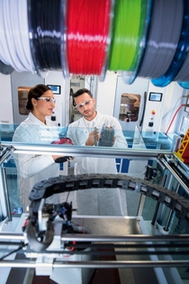 At the Application Technology Center in Heidelberg, Germany, BASF tests new powders, resins, filaments and granulates for 3D printing and develops solutions for industrial additive manufacturing. Fernanda Kraft, application technician 3D printing and Alexander Gengel, application technician 3D printing, during filament and printer preparation before starting a new 3D printing cycle
