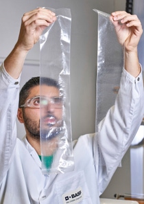 Burak Karadeniz, Lab technician at the Application Centre for BASF Plastic Additives in Kaisten, is comparing the optical properties of recycled film with and without a stabilizer package.