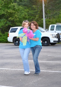 BASF employees Bonita Walley and Rena Whigham proudly display the company’s spirit stick while participating in the Relay walk.