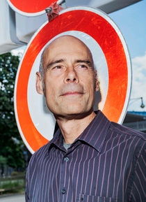 Stefan Gössling in front of a 'No Entry' sign.