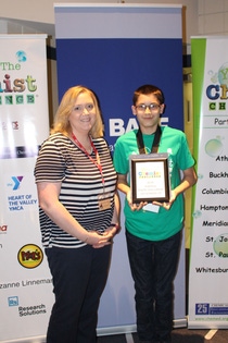 Robert Jackson, an eighth grade student at Meridianville Middle School, stands with his science teacher as one of three students to receive a runners up award