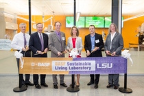 Representatives from BASF and LSU participate in the ribbon-cutting ceremony for the BASF Sustainable Living Lab at Louisiana State University.