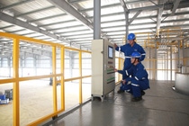 Production operators working at the control panel at the concrete admixtures production plant in Bac Giang, Vietnam