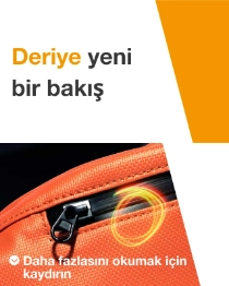 Close-up of an orange zipper on a bag with a light swirl. The text reads: "A new kind of leather." Close-up of an orange zipper on a bag with a light swirl. The text reads: "A new kind of leather."