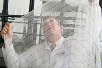 Interceptor® G2 from BASF is the first WHO-recommended mosquito net based on non-pyrethroid chemistry to beat insecticide-resistant mosquitoes. Its distinctive black and white stripes distinguish it from currently used mosquito nets. Volker Frenz, development chemist for Interceptor® G2, checks a net sample in the laboratory.
Photo – Andres/BASF