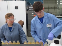 Jessica Lacy and Benjamin Burleson, interns from the University of South Alabama, analyze wastewater treatment samples in the environmental lab.