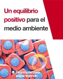 Pastillas rojas y azules para lavavajillas. Una espiral de luz revolotea sobre las pastillas. En el texto de la imagen pone: “Un equilibrio positivo para el clima”. 
