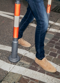 Close-up of Stefan Gössling's legs on a bike path