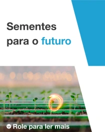 Um homem e uma criança estão em pé em uma cozinha, preparando legumes frescos juntos. Um redemoinho de luz paira sobre o balcão. O texto diz: “Sementes para o futuro”.
