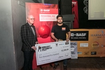 2018 Detroit Sketchbattle winner, Shubham Singh, accepts his $2,500 check from Paul Czornij, Head of Design for BASF in North America, in front of the custom color Paranormal Red. (photo by Trista Dymond) 2018 Detroit Sketchbattle winner, Shubham Singh, accepts his $2,500 check from Paul Czornij, Head of Design for BASF in North America, in front of the custom color Paranormal Red. (photo by Trista Dymond)