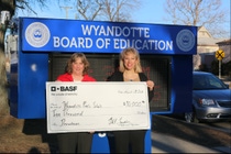 Marika Diamond (Right) of BASF presents a $10,000 check to school superintendent Catherine Cost, who accepted the donation on behalf of Wyandotte Public School’s STEM education program. Marika Diamond (Right) of BASF presents a $10,000 check to school superintendent Catherine Cost, who accepted the donation on behalf of Wyandotte Public School’s STEM education program.