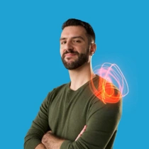 A male BASF employee stands with arms crossed in a dark green long-sleeve shirt in front of a blue background. A red-pink light swirl hovers above his shoulder.